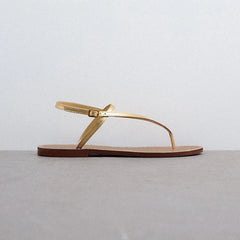 Goldstep Leather Flat Sandals — Luxe Édition | صندل جلدي ذهبي مسطح فاخر